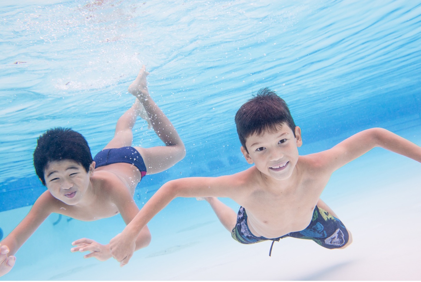 two boys swimming