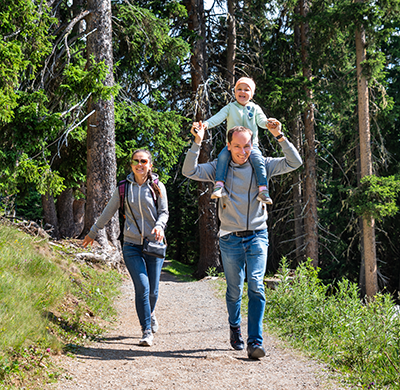 Family hiking in woods in Kemptville Ontario Travel Agency