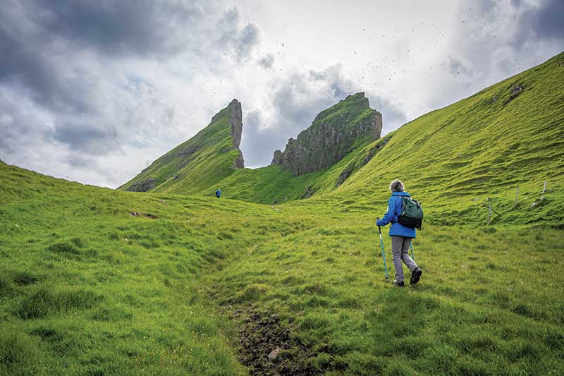 Adventure Canada - Lone hiker on grassy hills