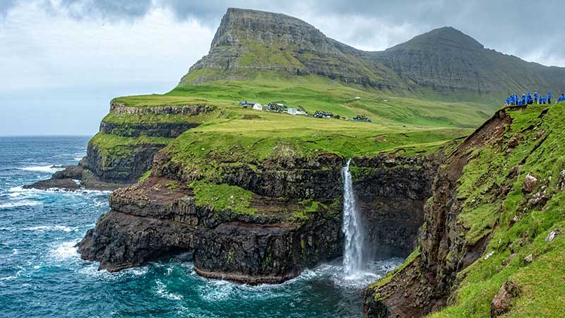 Adventure Canada - Ocean cliffs with water fall