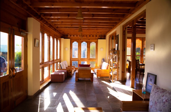 Dhumra Farm Resort, Punakha - Lobby with sun shining in windoes