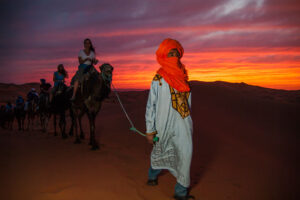 G Adventures Morocco Sahara Desert Dunes Sunset Camel Ride Travellers Local Guide